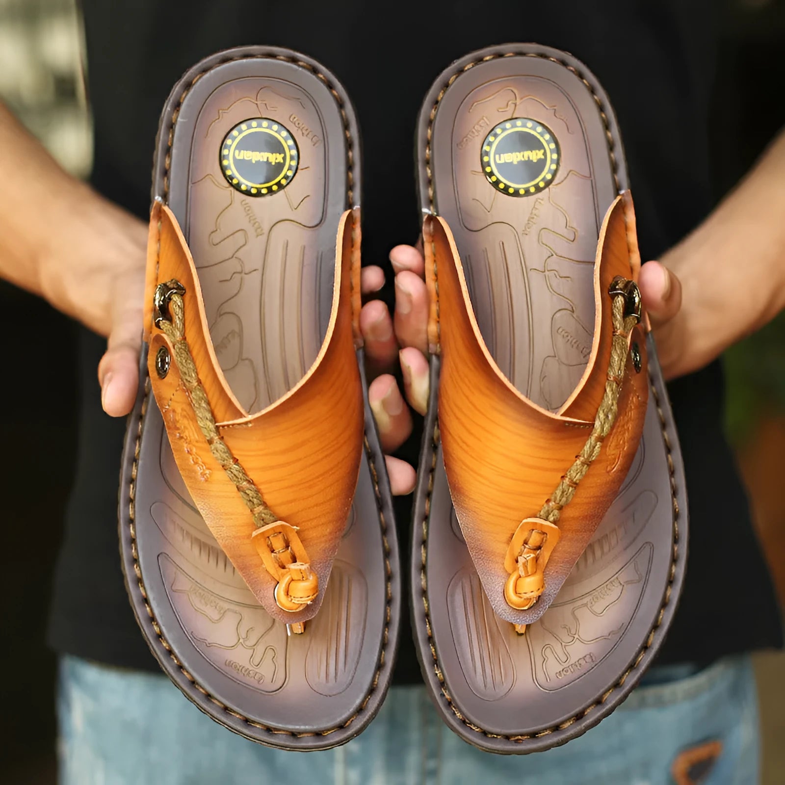 Men's dark blue herringbone patterned outdoor slippers with leather lining and rubber sole, shown in a large size.