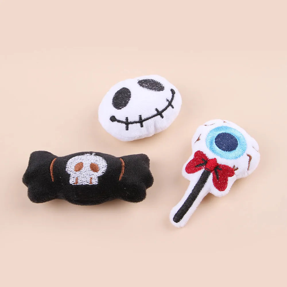 Small plush cat teaser wand with candy and skull designs for indoor play