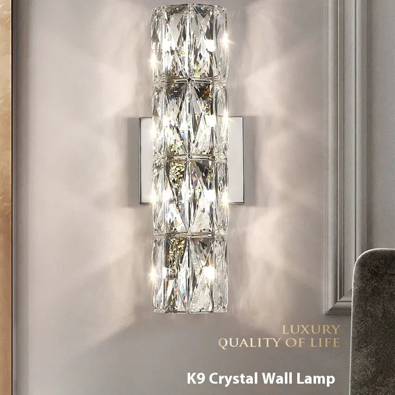 Crystal shade LED wall lamp in chrome or gold finish on stainless steel base.