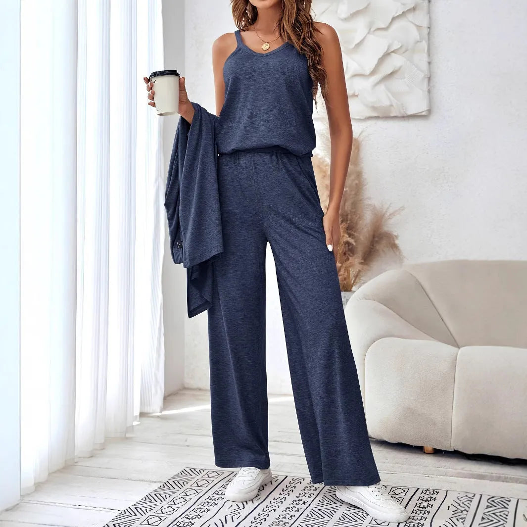 Blue women's three-piece co-ord suit with jumper top, long cardigan, and trousers with suspenders.