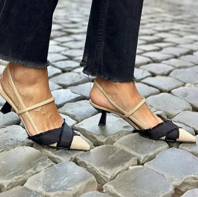 Women's apricot and black colour block stiletto sandals with pointed toe and buckle.