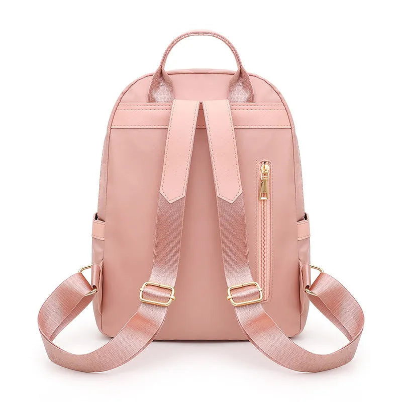 Women's black nylon casual backpack with double shoulder straps and external pockets