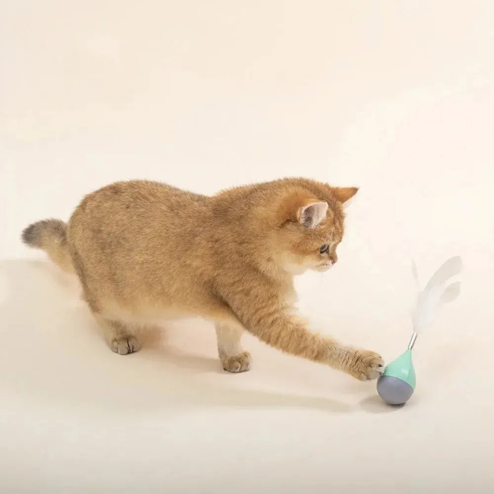 Green or pink feather tumbler cat toy with aluminium rod and self-healing ball component
