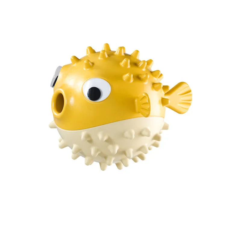 Green fish-shaped interactive dog toy with treat dispensing opening and textured surface for dental cleaning