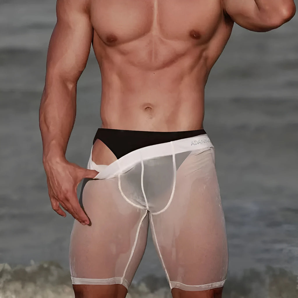 Men's seamless knit nylon home shorts in black, shown flat.