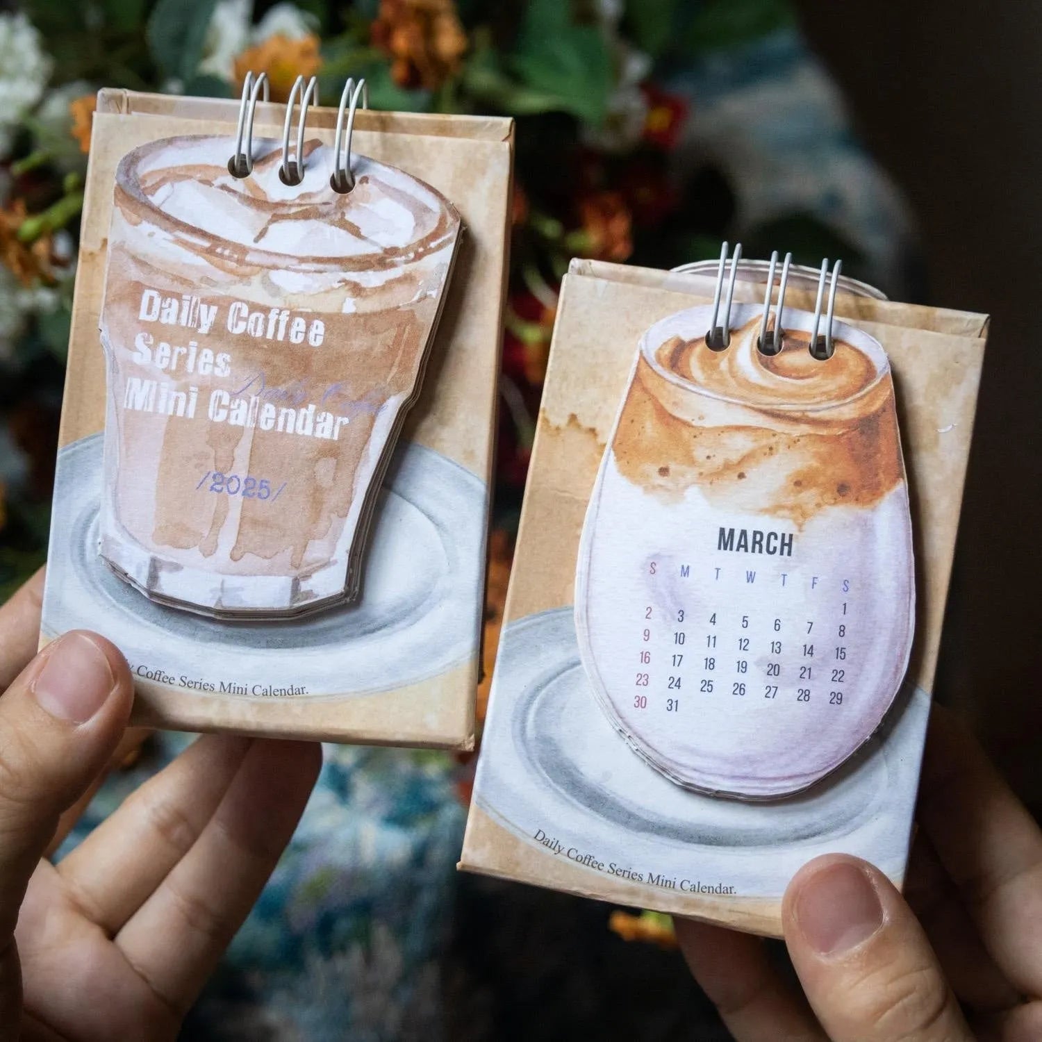 Mini coffee desk calendar 2025 with four design options on small desk surface