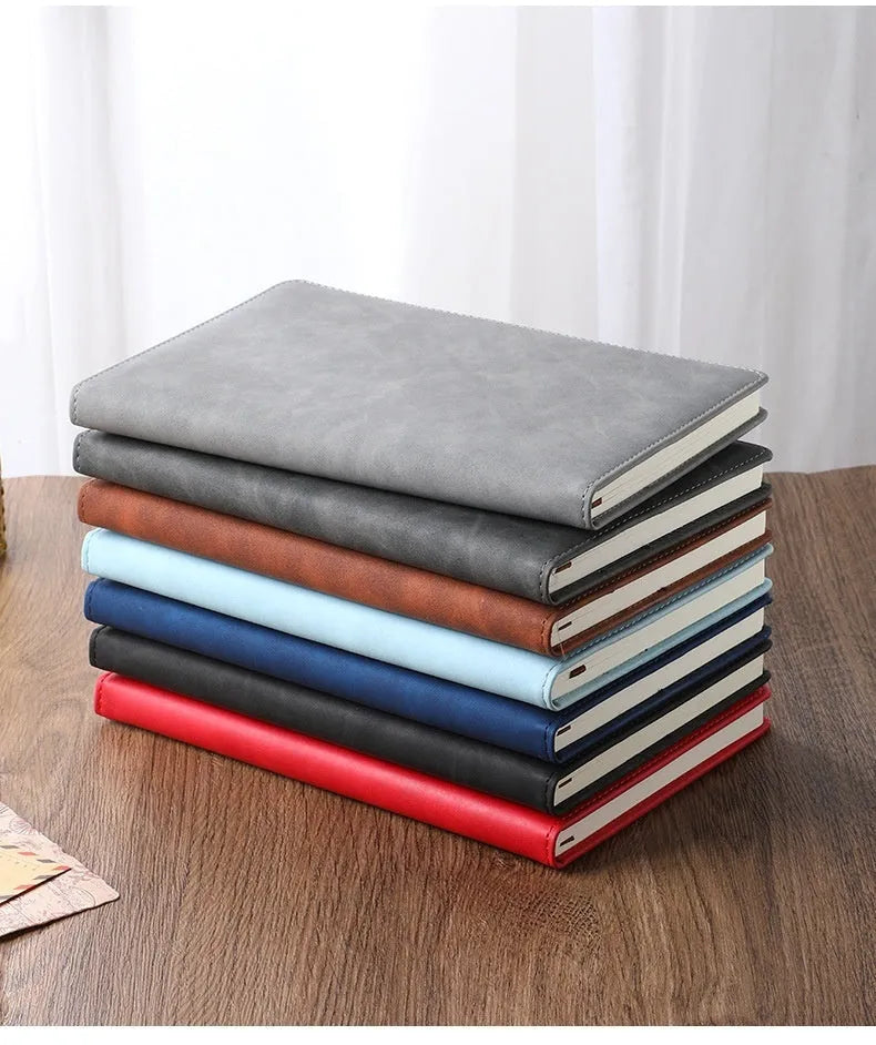 A5 notebook with PU leather cover in various colours including black, red, green, blue, and orange