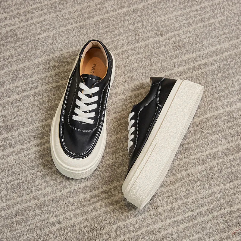 Women's black platform sports board shoes with embossed cowhide upper and lace-up closure