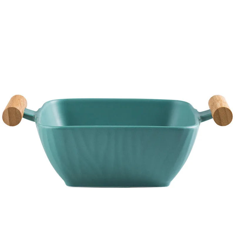 Ceramic bowl with irregular shape and matching lid in heat-resistant porcelain