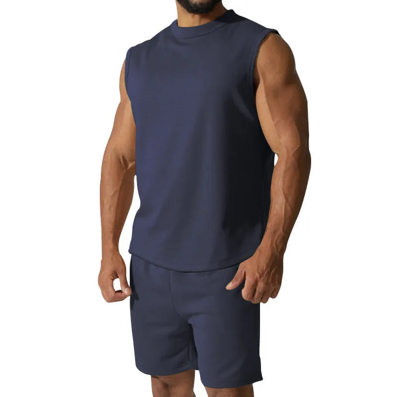 Men's sleeveless cotton blend sports top and matching shorts in a solid colour, laid flat.