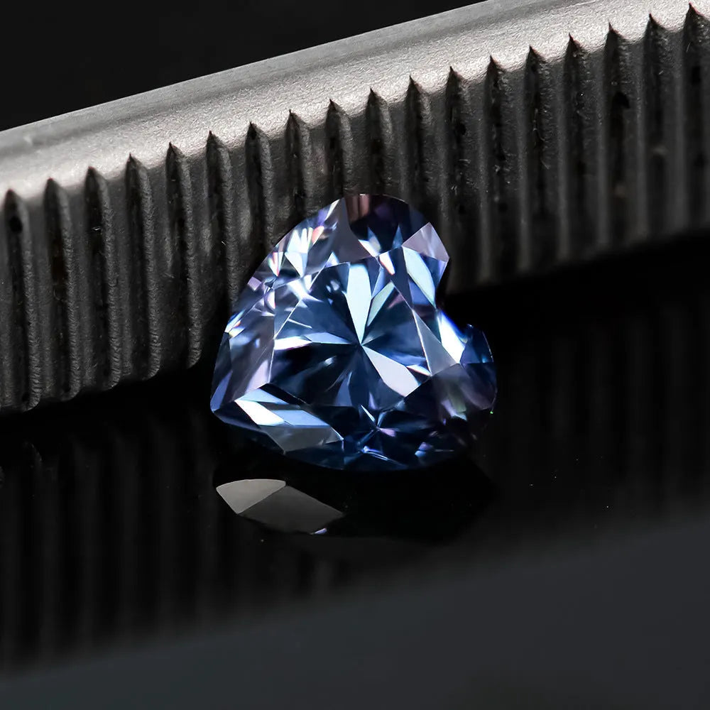 Heart-shaped moissanite gemstone in lemon yellow colour, shown alongside other colour options.
