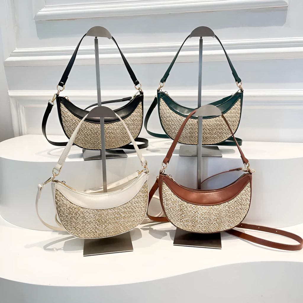 Women's hard straw dumpling-shaped crossbody bag in multiple colours with contrast stitching and internal organiser pockets.