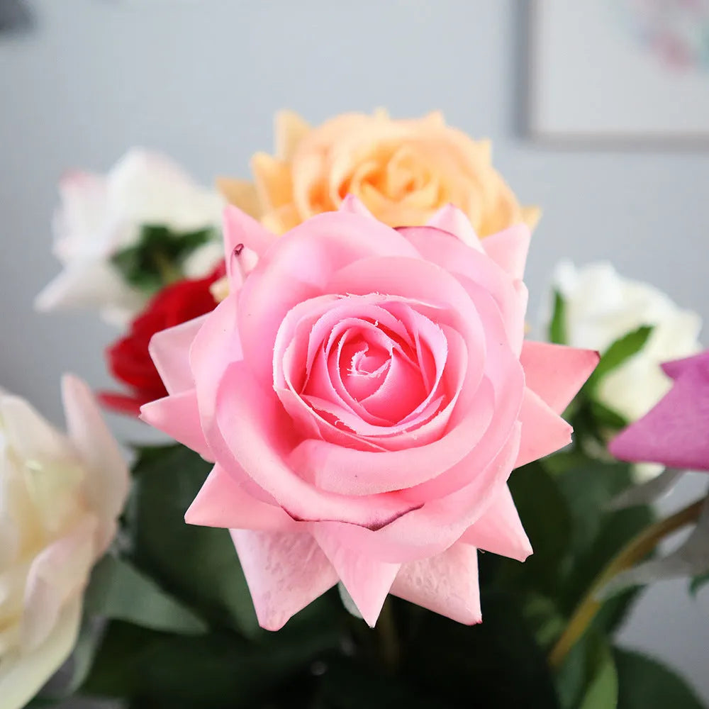 Artificial silk rose flower with red petals and green plastic stem measuring approximately 42cm long