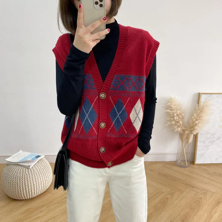 Woman wearing a sleeveless loose-fit cardigan top with a diamond plaid pattern in khaki.