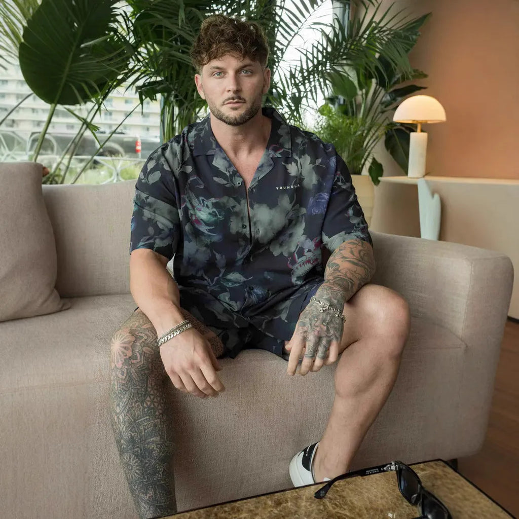 Men's loose floral print short-sleeve casual top in light colour on hanger