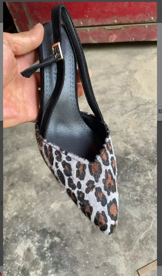 Leopard print suede women's sandals with a scattered pointed toe and high heel.