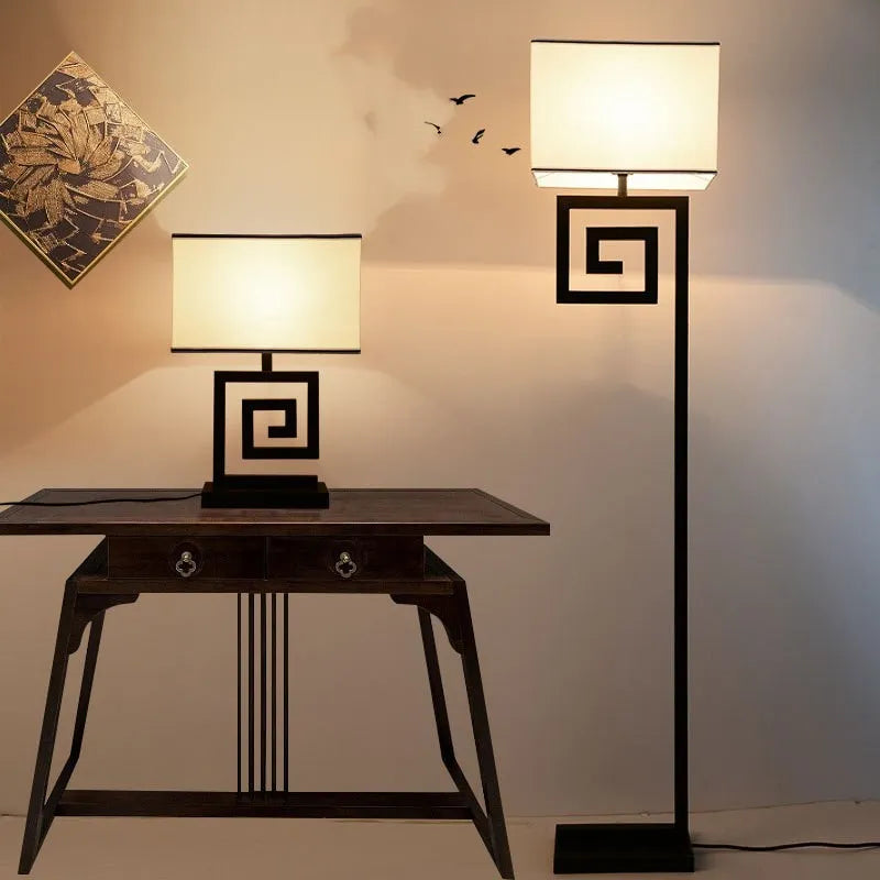 Retro modern Chinese table lamp with fabric lampshade and iron base on wooden side table