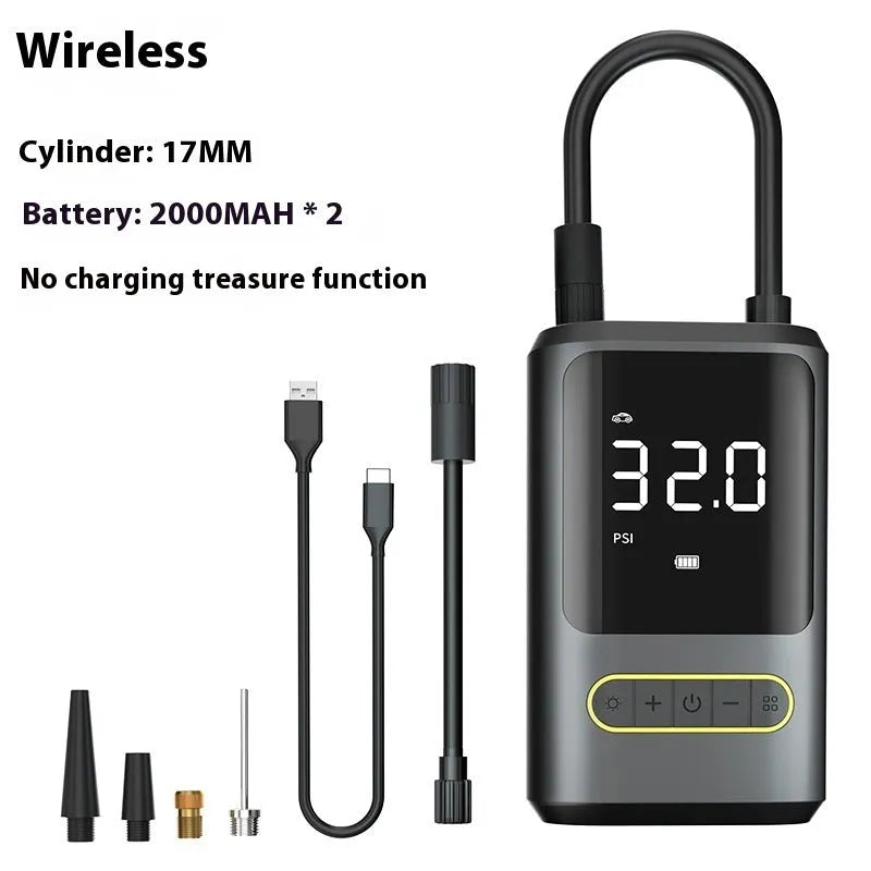 Mini portable wireless car tyre inflator with LED light, black, on a garage floor