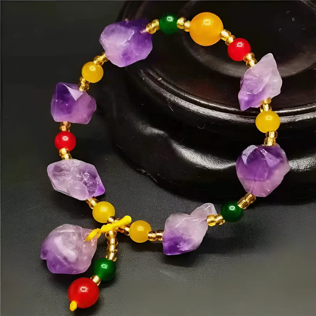 Purple natural shaped amethyst bead bracelet for women with a fu character charm.