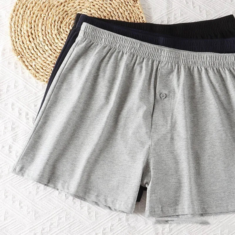 Men's high waist cotton boxer shorts in light grey, dark blue, and black colours.
