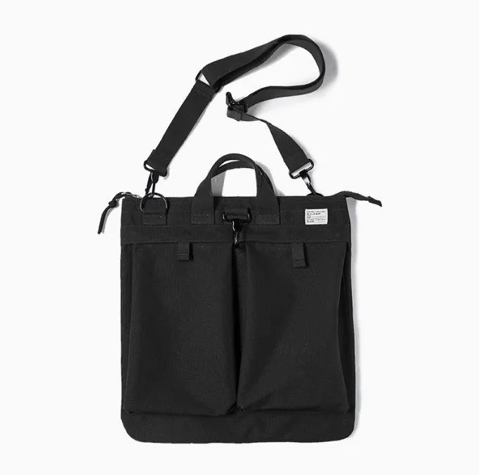Retro canvas crossbody messenger bag in military green showing laptop compartment and phone storage