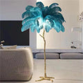 Tall decorative resin floor lamp with feather details in choice of dark green, pink, or white colours