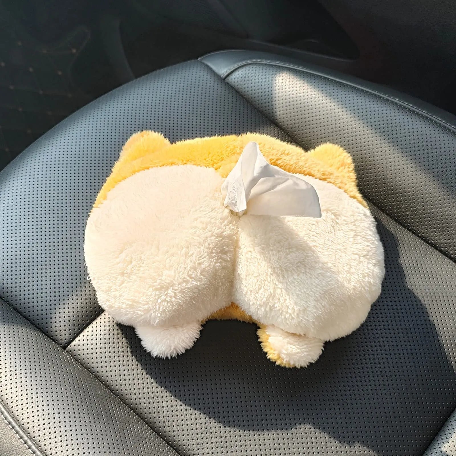 Yellow soft corgi butt shaped tissue box cover with elastic strap for car sun visor.