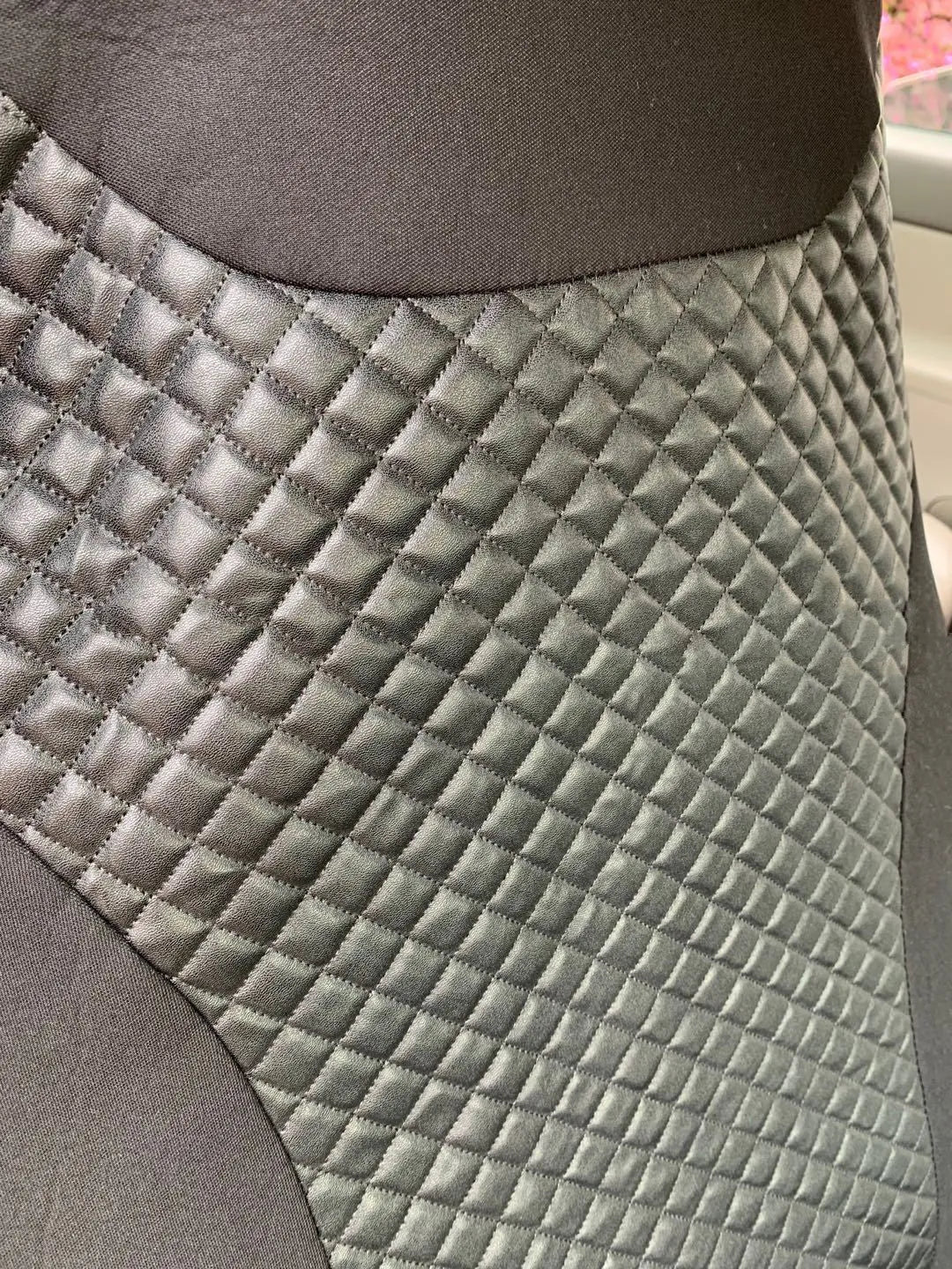 Black quilted automotive seat cover made from PU composite fabric with plastic hooks
