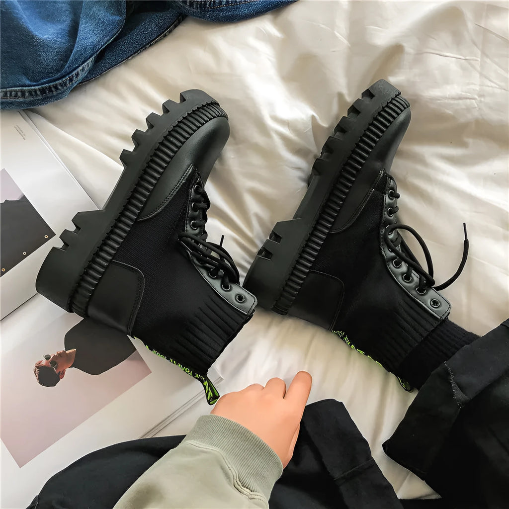 Men's black frosted leather platform ankle boots with a side zip and high-top design.