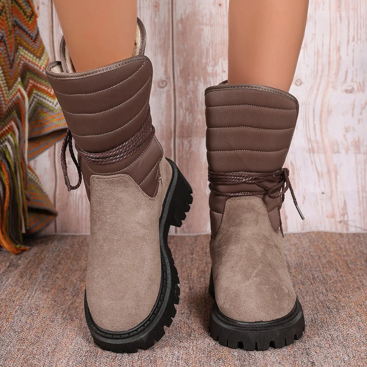 Women's chunky heel mid-tube snow boots in black with lace-up design and rubber sole