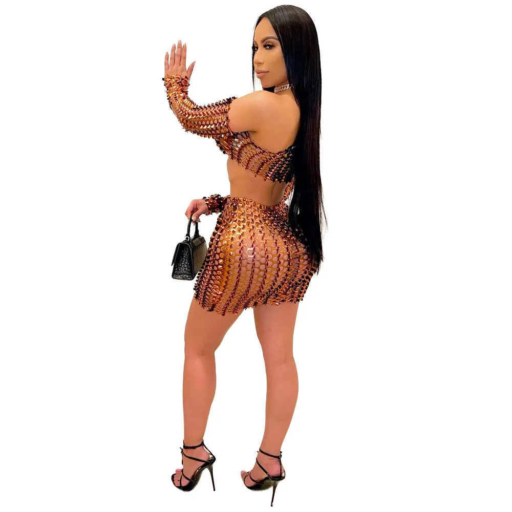 Women's black hollow-out net detail two-piece dress set with sleeveless top and short skirt.