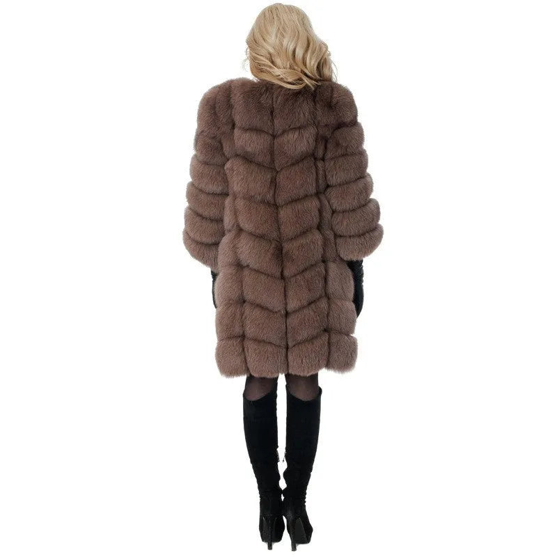 Women's thick black artificial fur coat with regular sleeves on a model.