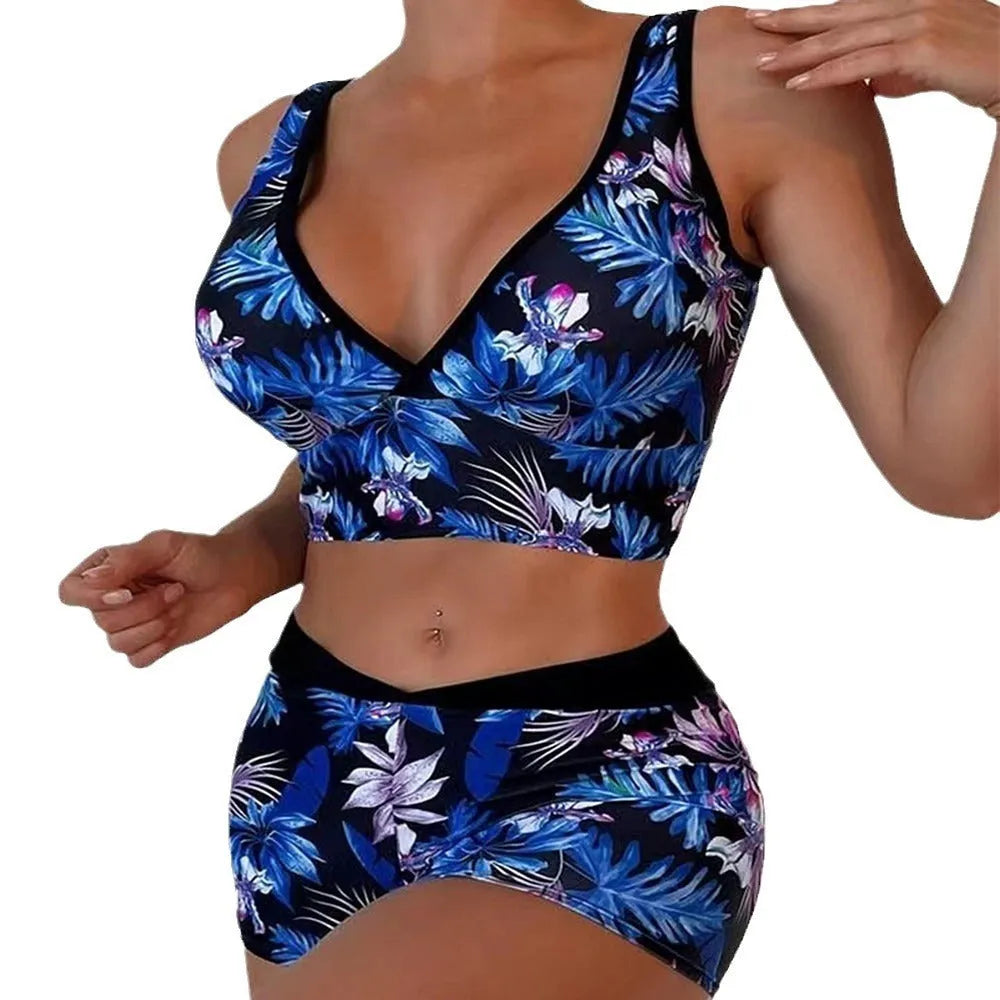 Women's two-piece swimsuit with sleeveless top and printed boxer brief bottoms in a multi-colour pattern.