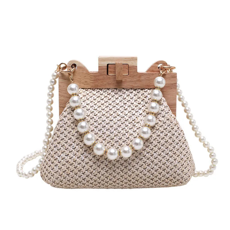 Women's straw woven shoulder bag with pearl chain detail in horizontal square shape