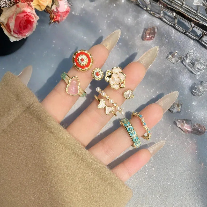 Adjustable copper ring with vintage gourd, floral, and bow design in New Chinese style, set with zircon stones.