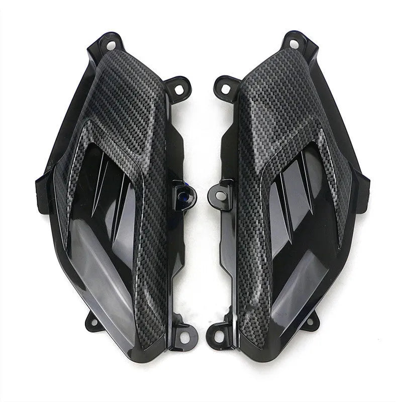 Yamaha NMAX side lamp replacement kit showing ABS plastic shell, PVC lamp shade, and stainless steel screws