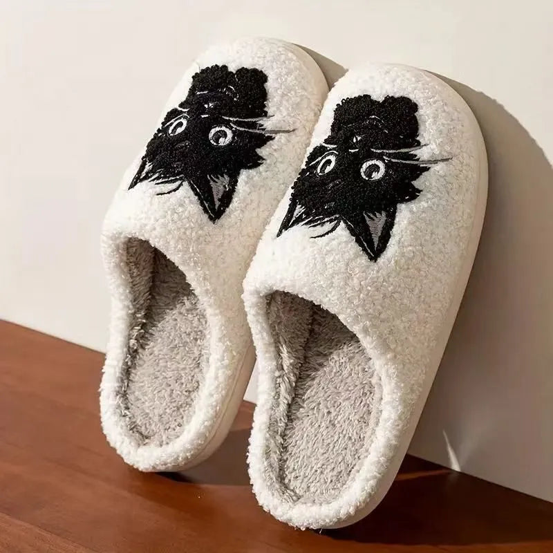 White plush couple slippers with black beard cat cartoon design and non-slip soles.