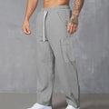 Men's straight-leg corduroy cargo trousers in a loose wide-leg fit with a drawstring waist.