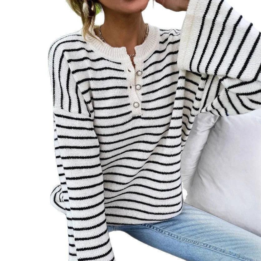 Black and white striped women's loose top with drop-shoulder sleeves and button detail