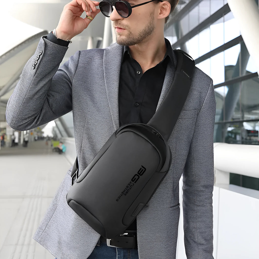 Men's blue Oxford cloth shoulder bag with a USB charging port on the front.