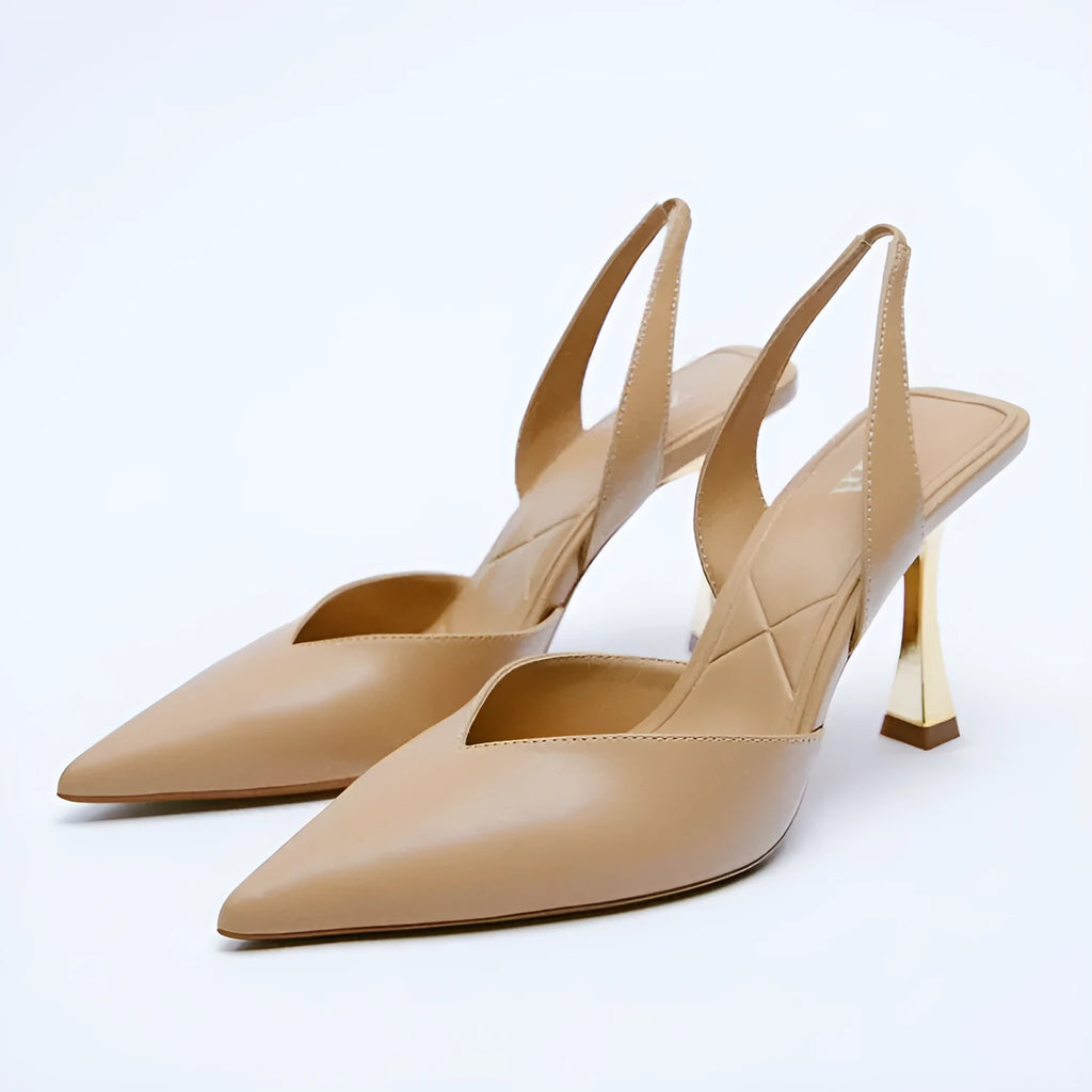 Women's patent leather pointed high heels in apricot and black colours, showing shallow mouth design.