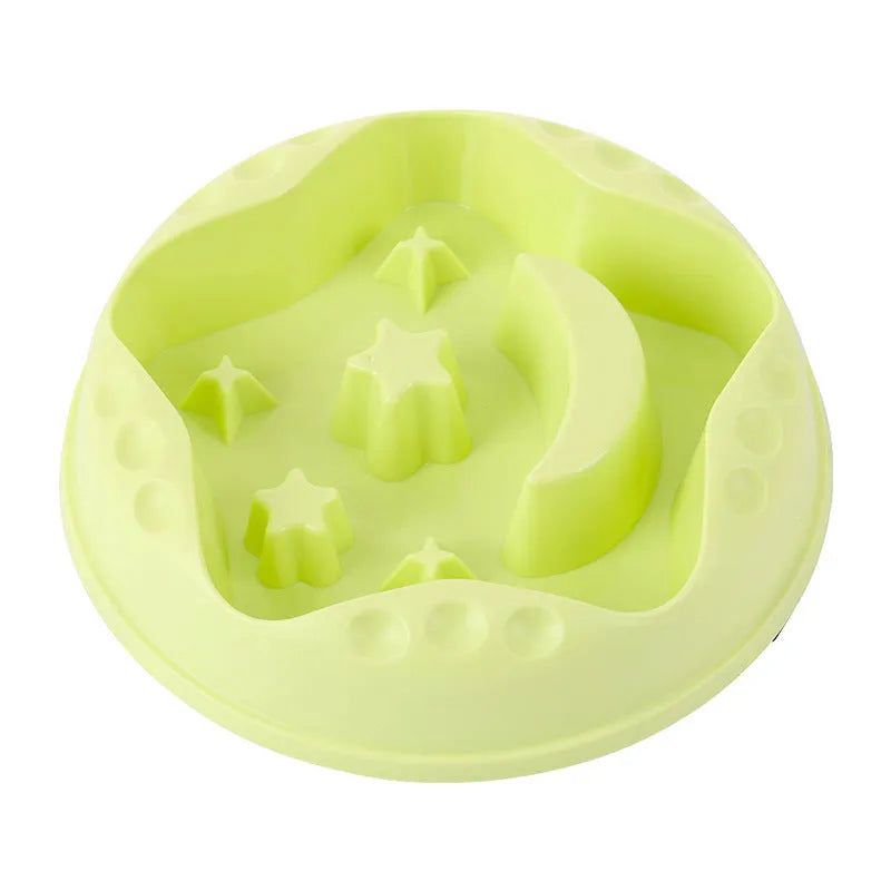 Blue slow feeder dog bowl with moon and star wing design and internal maze pattern.