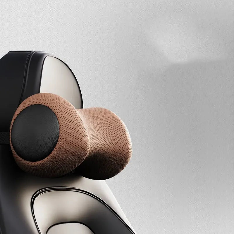A black car massage cushion with electric vibration controls, placed on a car seat for neck and lumbar support.