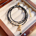 Blue sand stone three-ring multi-layer bracelet with gold-coloured metal detailing and cut stone texture