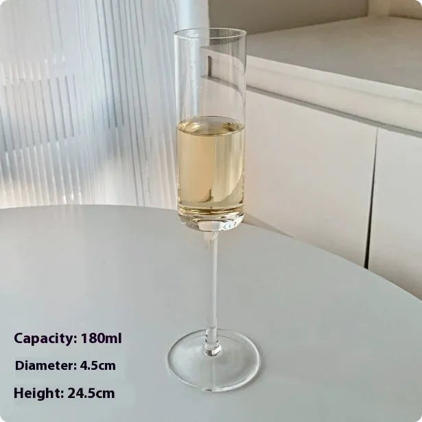 Six French crystal champagne glasses in various designs on dining table
