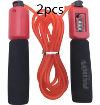 Adjustable skipping rope with blue foam handles and heavy-duty PVC cable on a grey background
