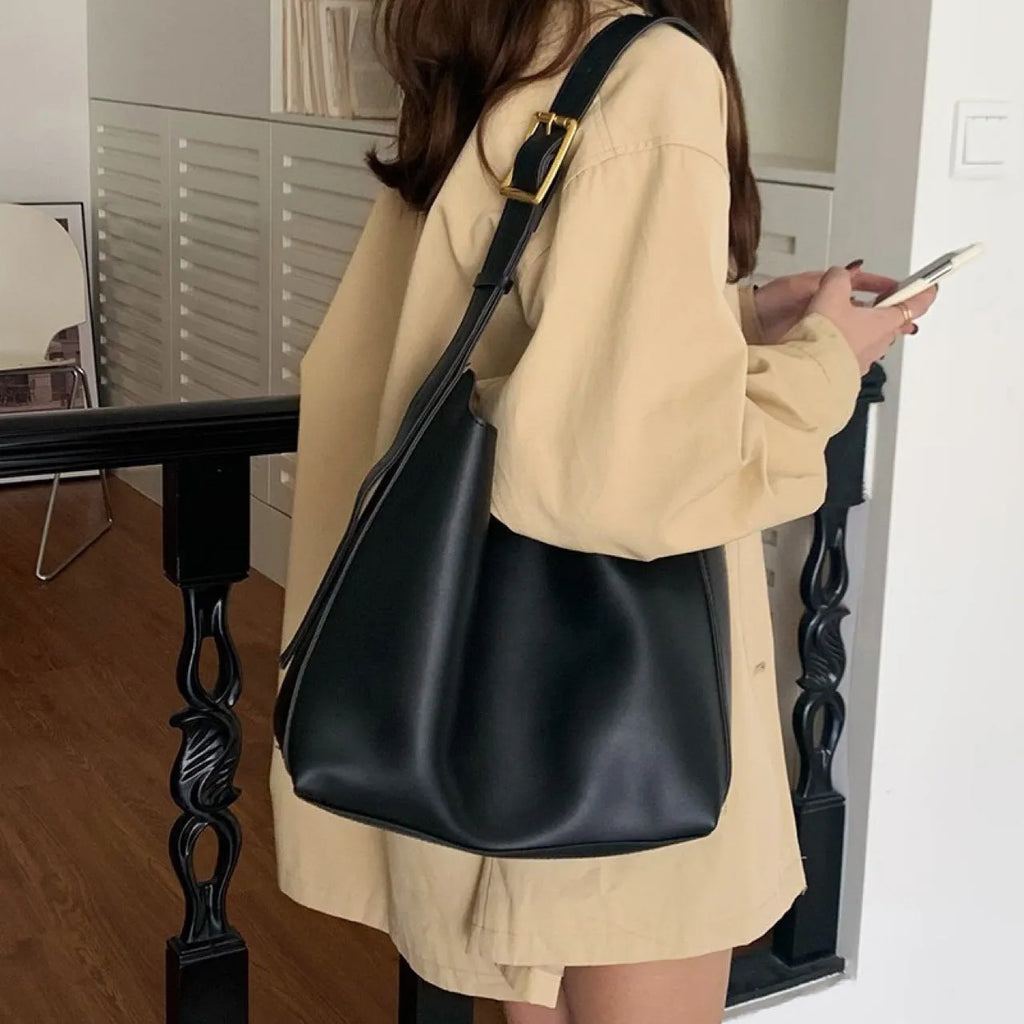 Soft PU leather shoulder bag with swing threads decoration in black or brown colour