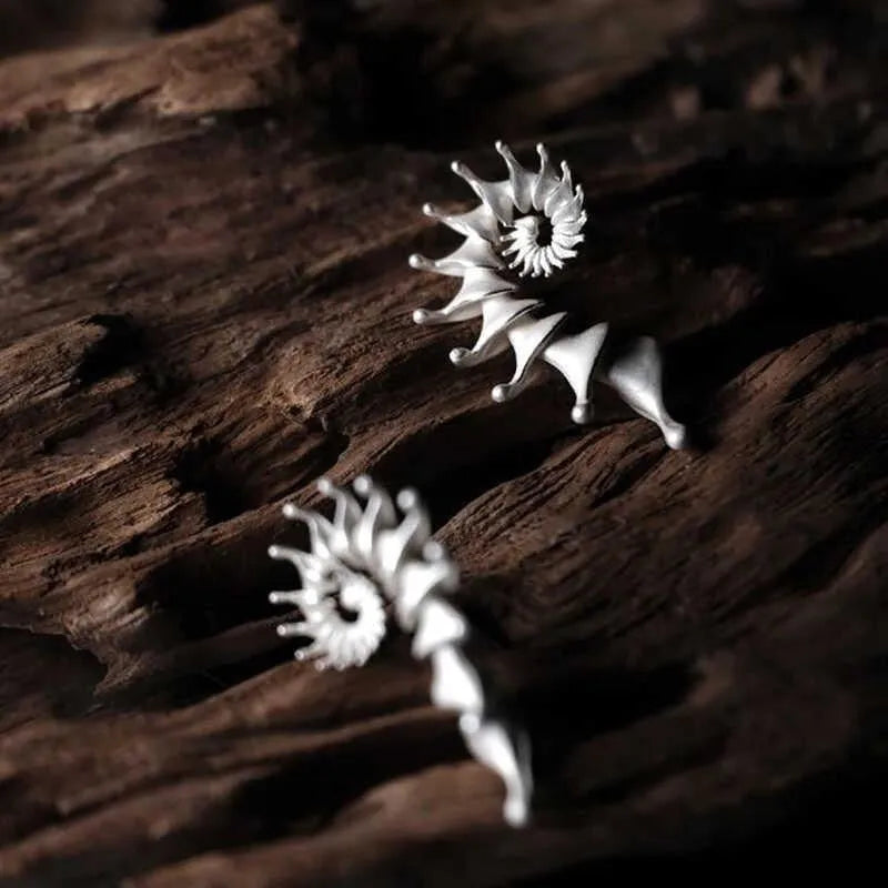 Matte finish conch stud earrings with exaggerated three-dimensional alloy design