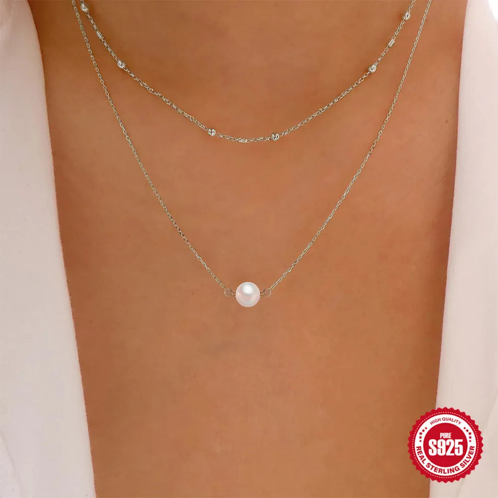 S925 sterling silver double layer women's necklace with twin pearls and geometric pendant on ball bead chain.