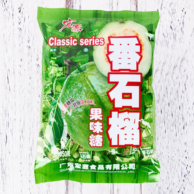 Three bags of Asian fruit hard candy: plum sugar, guava, and tangerine peel varieties with weight labels